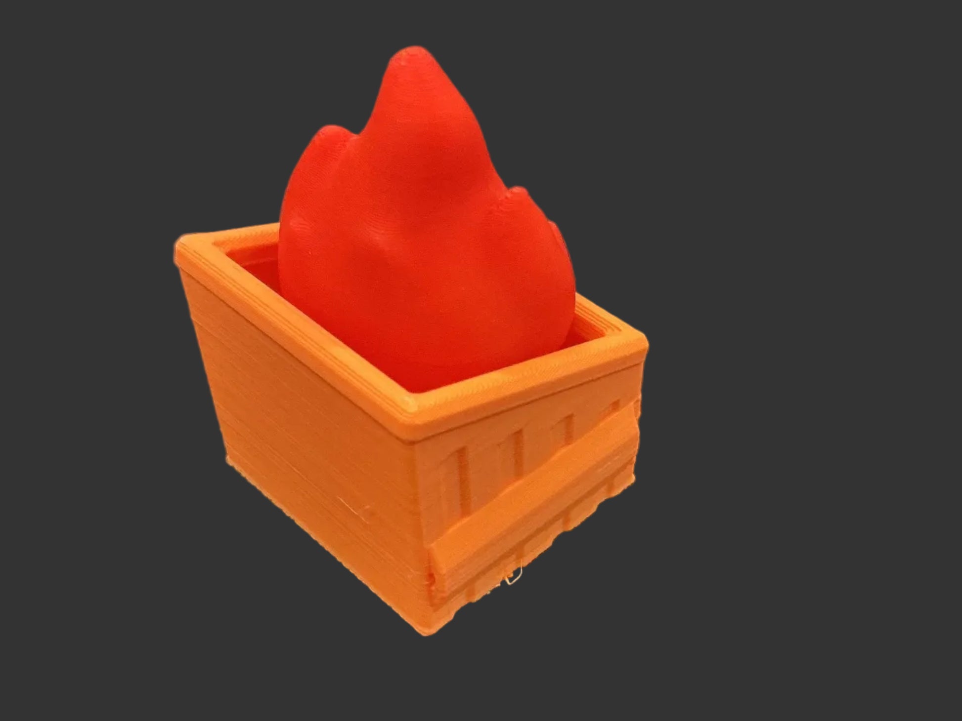 Red object inside an orange container on a gray background
